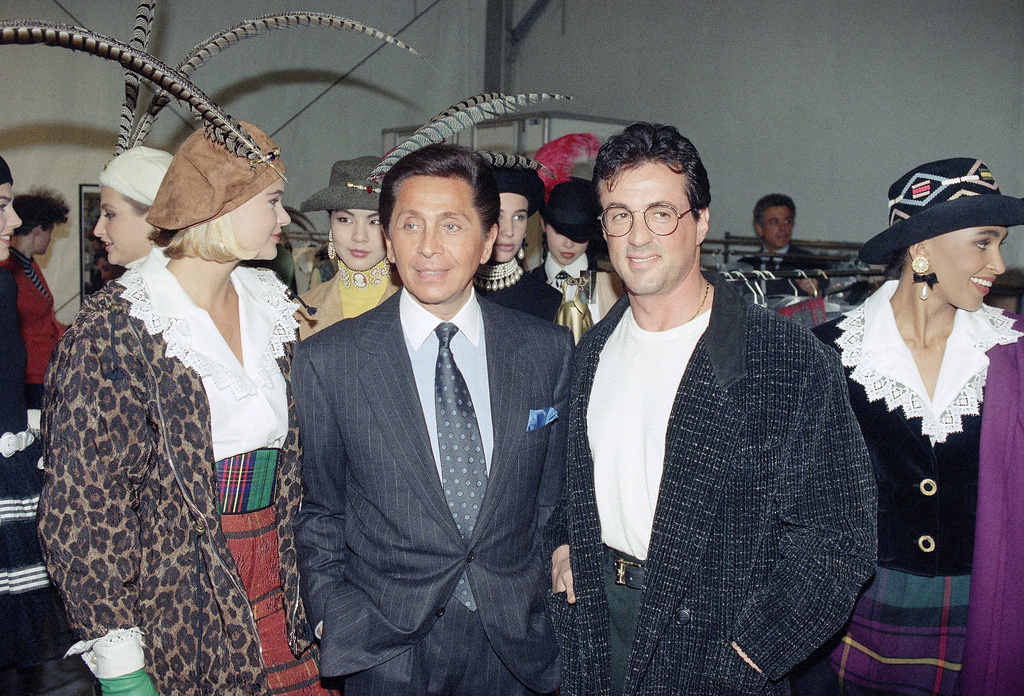 FILE - US actor Sylvester Stallone, right, meets Italian designer Valentino Garavani, left, ready to wear collection on March 17, 1991 in Paris, France. (AP Photo/Remy de la Mauviniere, File)