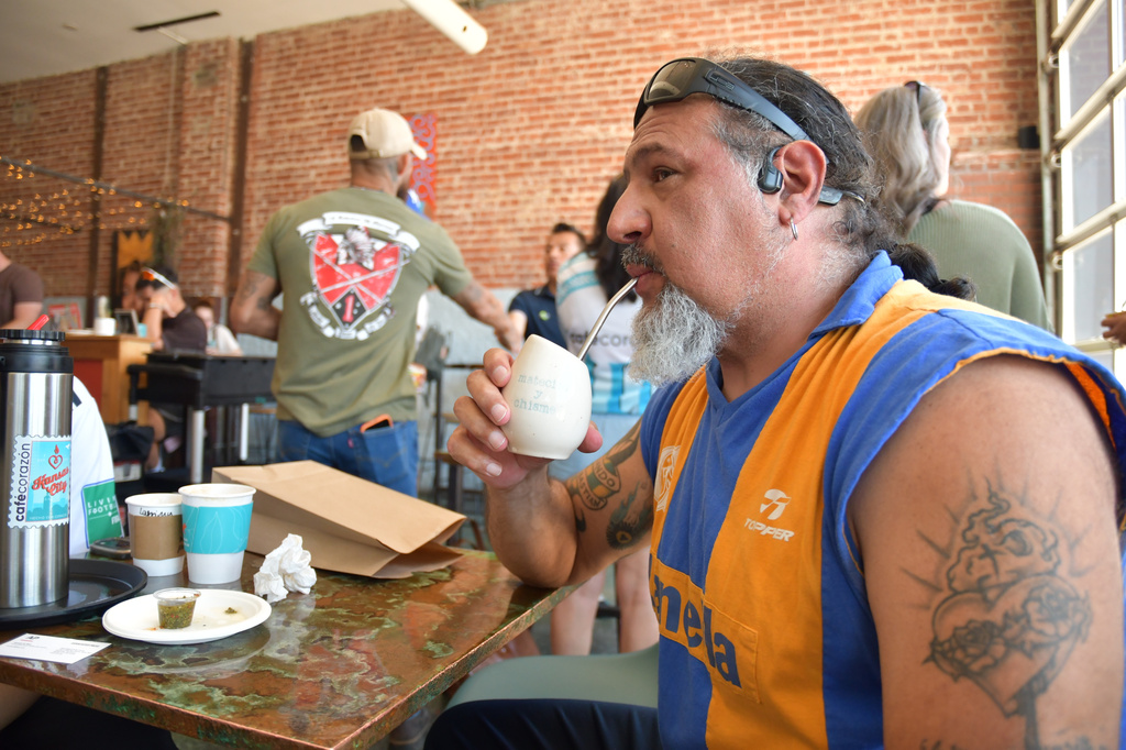 Rene Cufre, of Albuquerque, N.M., sips yerba mate at Cafe Corazon, Monday, June 15, 2026, in Kansas City, Mo. (AP Photo/Kristin M. Hall)
