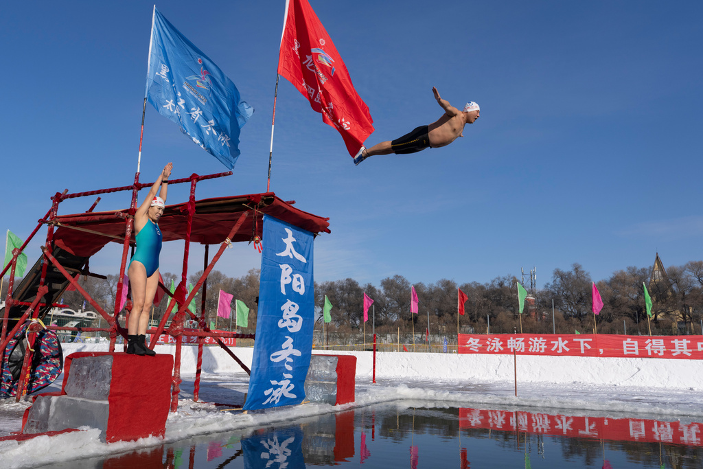 Winter swimmers take to the water in Harbin in China's Heilongjiang province on Sunday, Jan. 4, 2026. (AP Photo/Ng Han Guan)