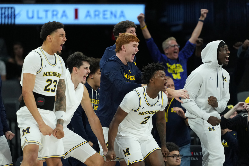 Michigan players celebrate a score against San Diego State during the second half of an NCAA college basketball game in Las Vegas, Monday, Nov. 24, 2025. (AP Photo/Eric Gay)