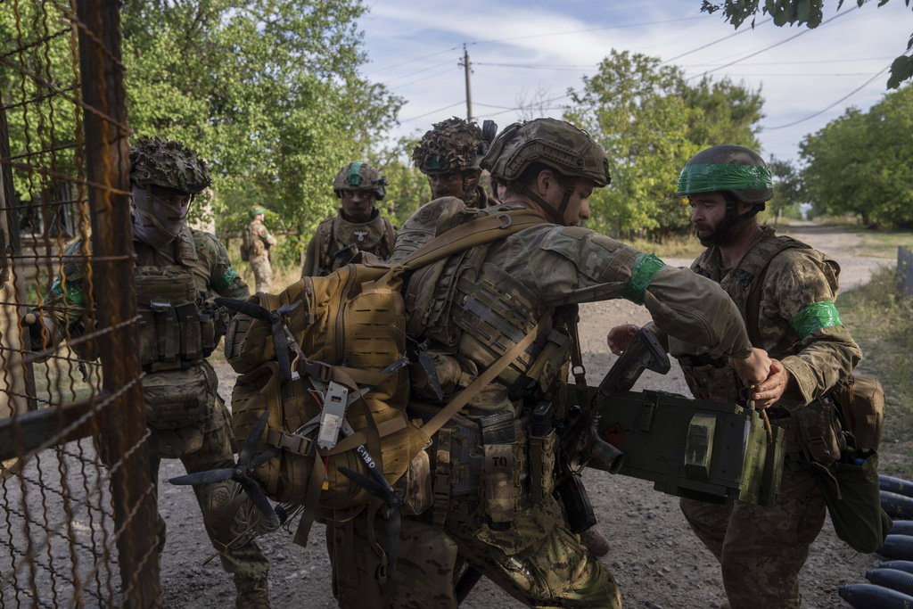 Ukrainian servicemen unload an autonomous vehicle close to the front line near Kostiantynivka, Ukraine, on Wednesday, Sept. 10, 2025. (AP Photo/Alex Babenko)