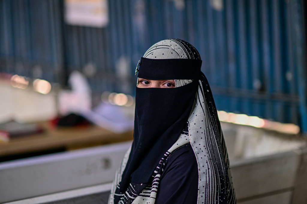 Hasina, a Rohingya refugee girl, sits inside the Rohingya refugee camp in Cox's Bazar, Bangladesh, Thursday, Nov. 20, 2025. (AP Photo/Mahmud Hossain Opu)