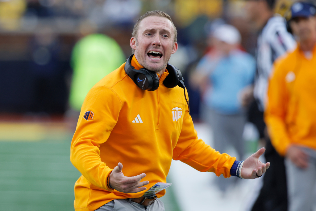 UTEP head coach Scotty Walden argues with an official during the first half of an NCAA college football game against Michigan, Saturday, Sept. 19, 2026, in Ann Arbor, Mich. (AP Photo/Duane Burleson)