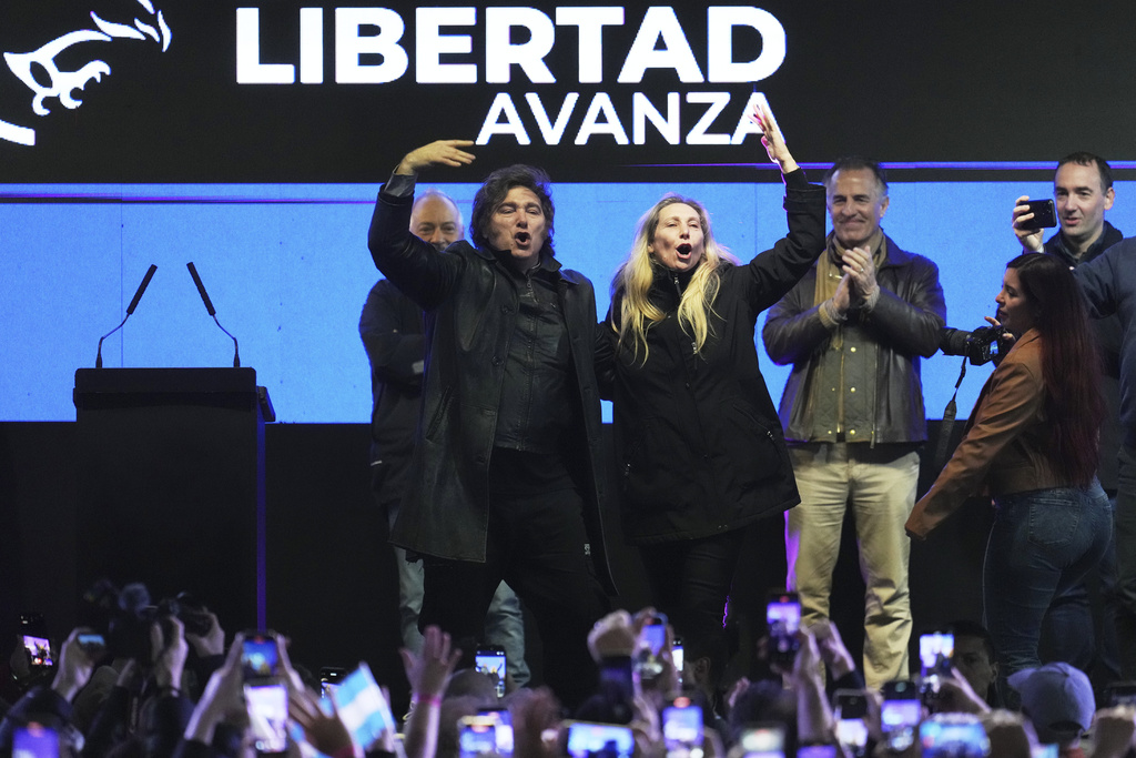 President Javier Milei, left, and his sister, General Secretary of the Presidency Karina Milei, gesture at supporters during a campaign rally ahead of legislative provincial elections, in Moreno, Buenos Aires province, Argentina, Wednesday, Sept. 3, 2025. (AP Photo/Natacha Pisarenko)