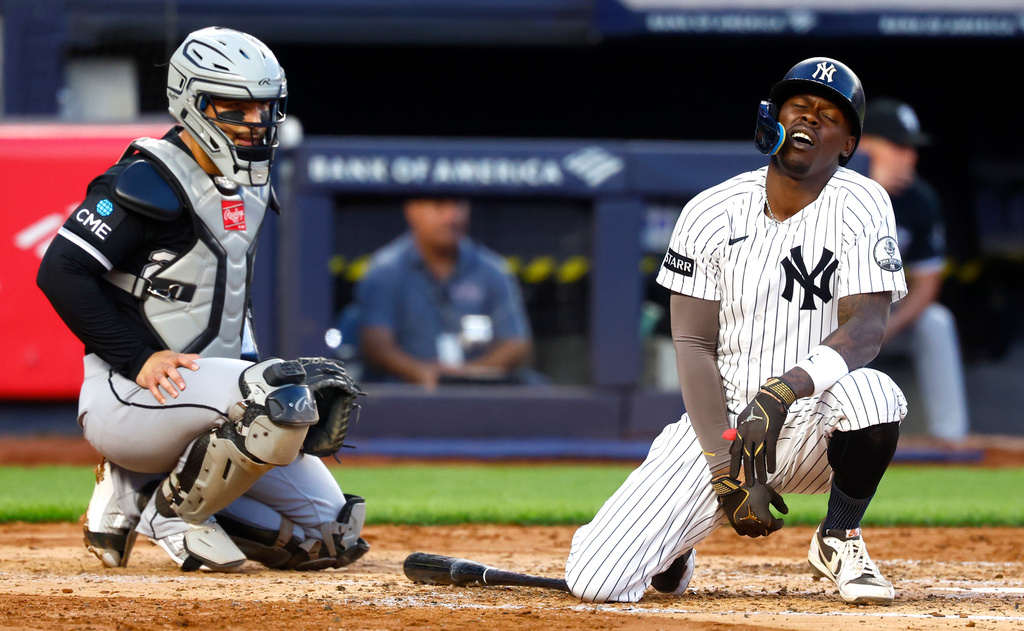 New York Yankees' Jazz Chisholm Jr., right, reacts after fouling a ball off himself during the fourth inning of a baseball game against the Chicago White Sox, Thursday, June 18, 2026, in New York. (AP Photo/Noah K. Murray)
