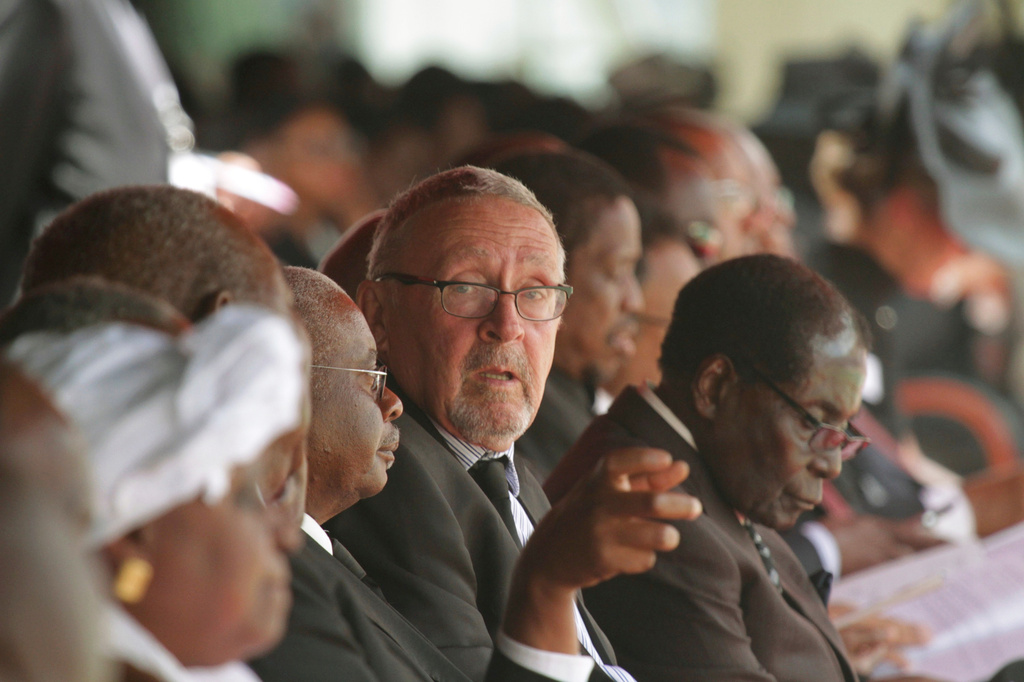 FILE - Acting Zambian President Guy Scott, center, attends the funeral of former Zambian President Michael Sata, Nov, 11, 2014, in Lusaka. (AP Photo/Tsvangirayi Mukwazhi, File)