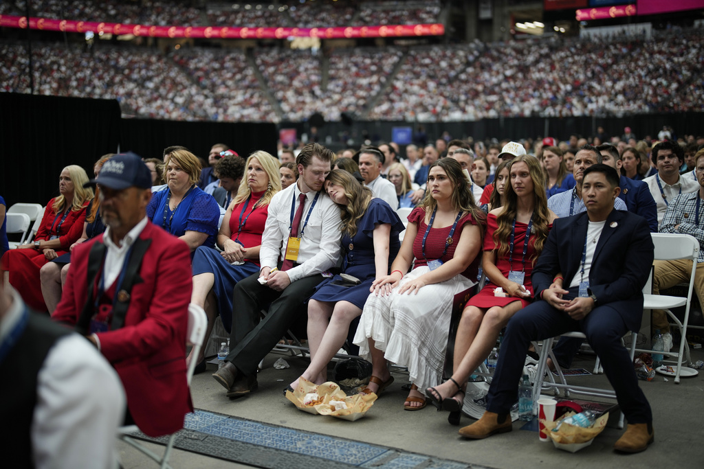 People listen as Erika Kirk speaks at a memorial for her late husband conservative activist Charlie Kirk, Sunday, Sept. 21, 2025, at State Farm Stadium in Glendale, Ariz. (AP Photo/John Locher)