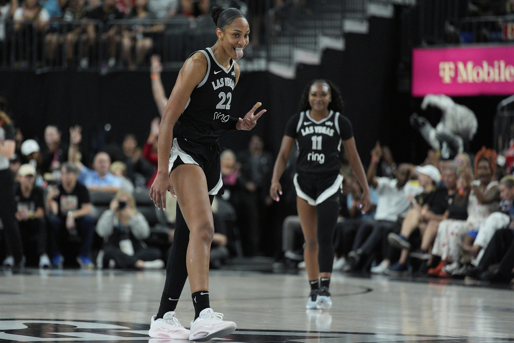 Las Vegas Aces center A'ja Wilson (22) celebrates after a play against the Minnesota Lynx during the second half of a WNBA basketball game Thursday, Sept. 4, 2025, in Las Vegas. (AP Photo/John Locher)