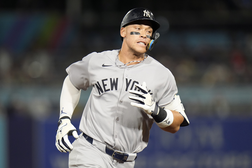 New York Yankees' Aaron Judge runs the bases after his solo home run off Tampa Bay Rays pitcher Shane Baz during the first inning of a baseball game Tuesday, Aug. 19, 2025, in Tampa, Fla. (AP Photo/Chris O'Meara)