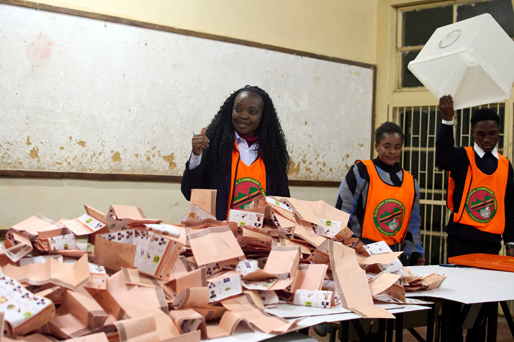 Election workers count ballots at a polling station in Lusaka, Zambia, Thursday, Aug. 13, 2026. (AP Photo/Alfonso Nqunjana) CORRECTION: Corrects the country to Zambia instead of South Africa.