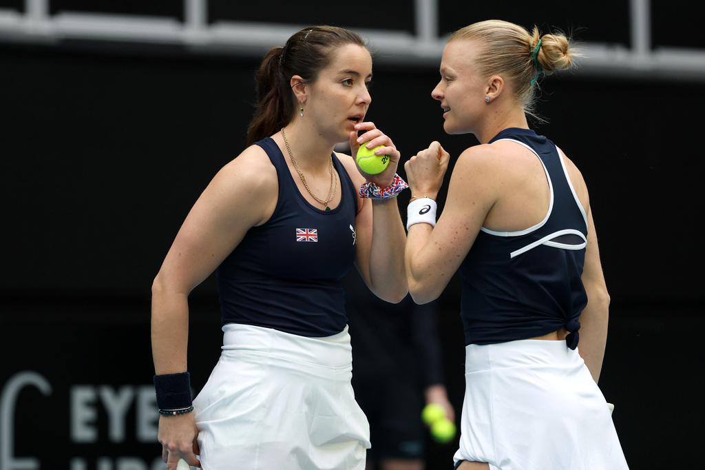 Britain's Harriet Dart and Jodie Burrage, right, talk while playing a doubles match against Australia in their Billy Jean King Cup tie in Melbourne, Saturday, April 11, 2026, (Con Chronis/AAP Image via AP)