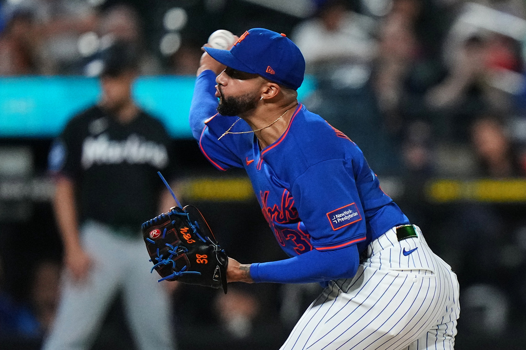 New York Mets' Devin Williams pitches during the ninth inning of a baseball game against the Miami Marlins Thursday, July 30, 2026, in New York. (AP Photo/Frank Franklin II)