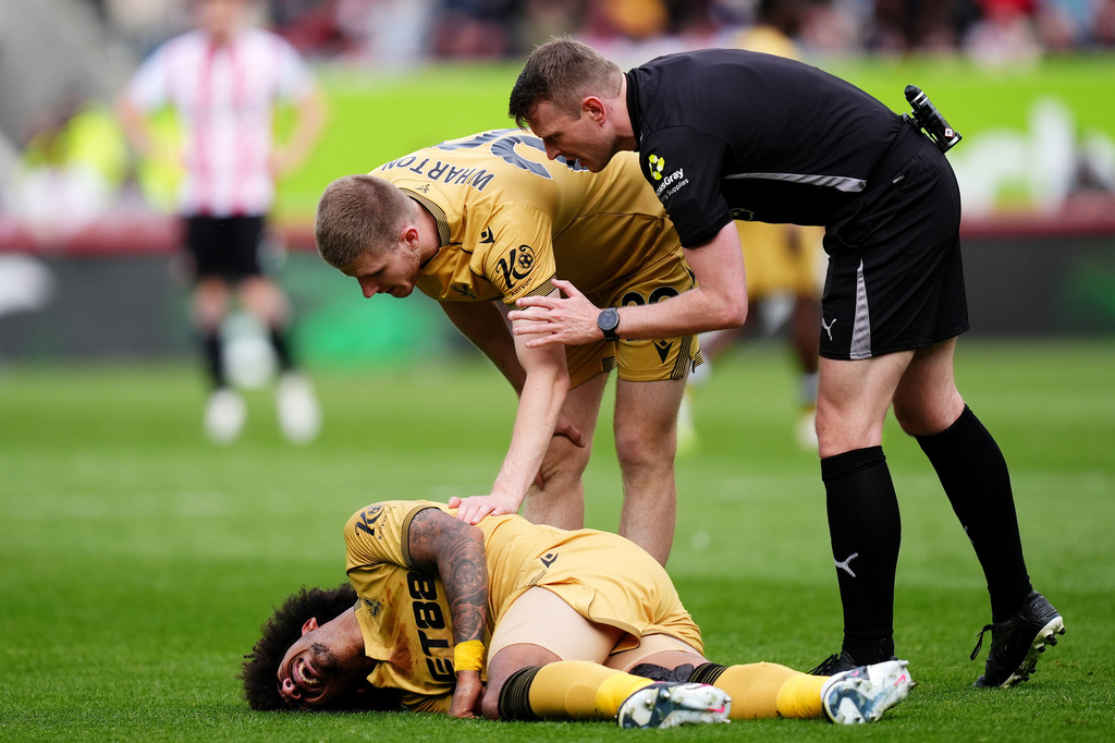 Crystal Palace's Chris Richards, bottom, reacts after going down with an injury during the Premier League soccer match between Brentford and Crystal Palace, Sunday, May 17, 2026, in London. (John Walton/PA via AP)