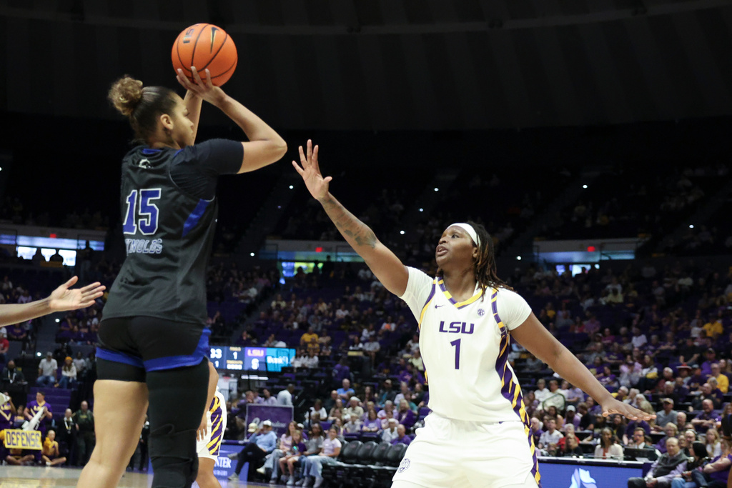 Texas-Arlington forward Mila Reynolds (15) shoots a jumper over LSU forward Amiya Joyner (1) in the first half of an NCAA college basketball game between Texas-Arlington and LSU in Baton Rouge, La., Sunday, Dec. 21, 2025. (AP Photo/Peter Forest)