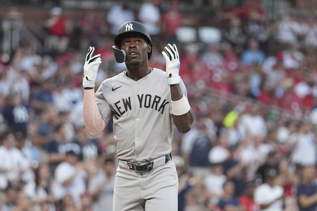 New York Yankees' Jazz Chisholm Jr. arrives home after hitting a two-run home run during the first inning of a baseball game against the St. Louis Cardinals Friday, Aug. 15, 2025, in St. Louis. (AP Photo/Jeff Roberson)
