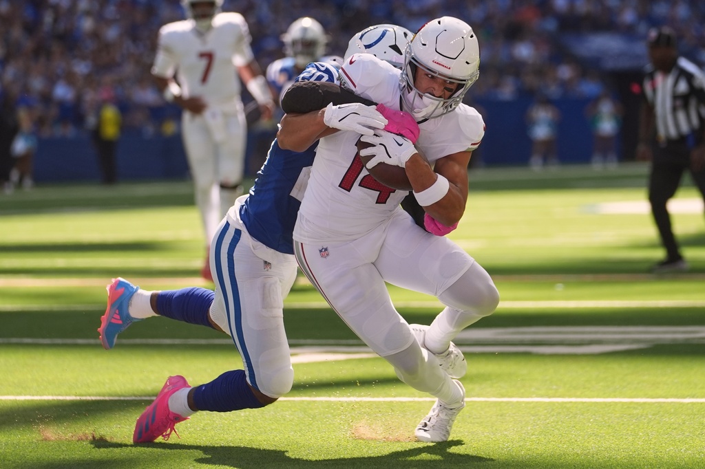 Indianapolis Colts' Nick Cross stops Arizona Cardinals' Michael Wilson during the first half of an NFL football game Sunday, Oct. 12, 2025, in Indianapolis. (AP Photo/Michael Conroy)