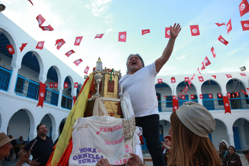 Jewish pilgrims during a ceremony as they attend an annual pilgrimage at the Ghriba synagogue in the resort of Djerba, Tunisia, on Monday, May 4, 2026. (AP Photo/Bassem Aouini)