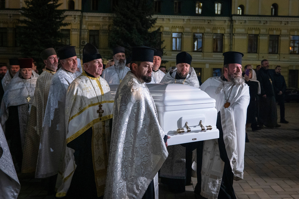 Clerics carry the coffin with Patriarch Emeritus Filaret of Ukraine's Orthodox Church during funeral service in St. Michael Cathedral in Kyiv, Ukraine, Friday, March 20, 2026. (AP Photo/Dan Bashakov)