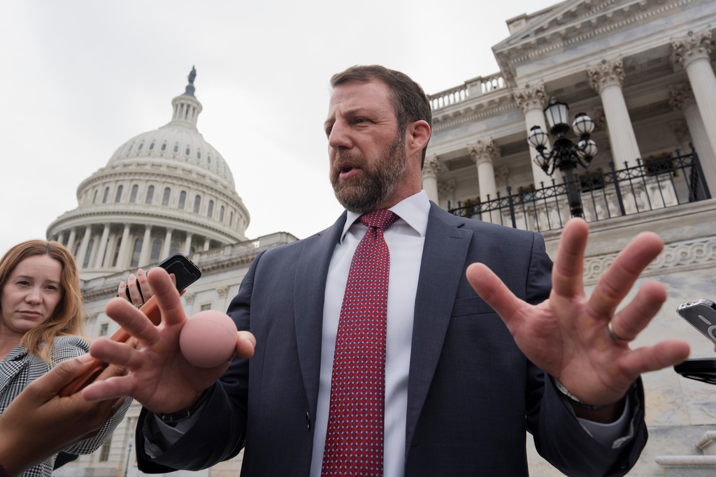 FILE - Sen. Markwayne Mullin, R-Okla., speaks with reporters on the steps at the Capitol in Washington, March 5, 2026. (AP Photo/J. Scott Applewhite, File)