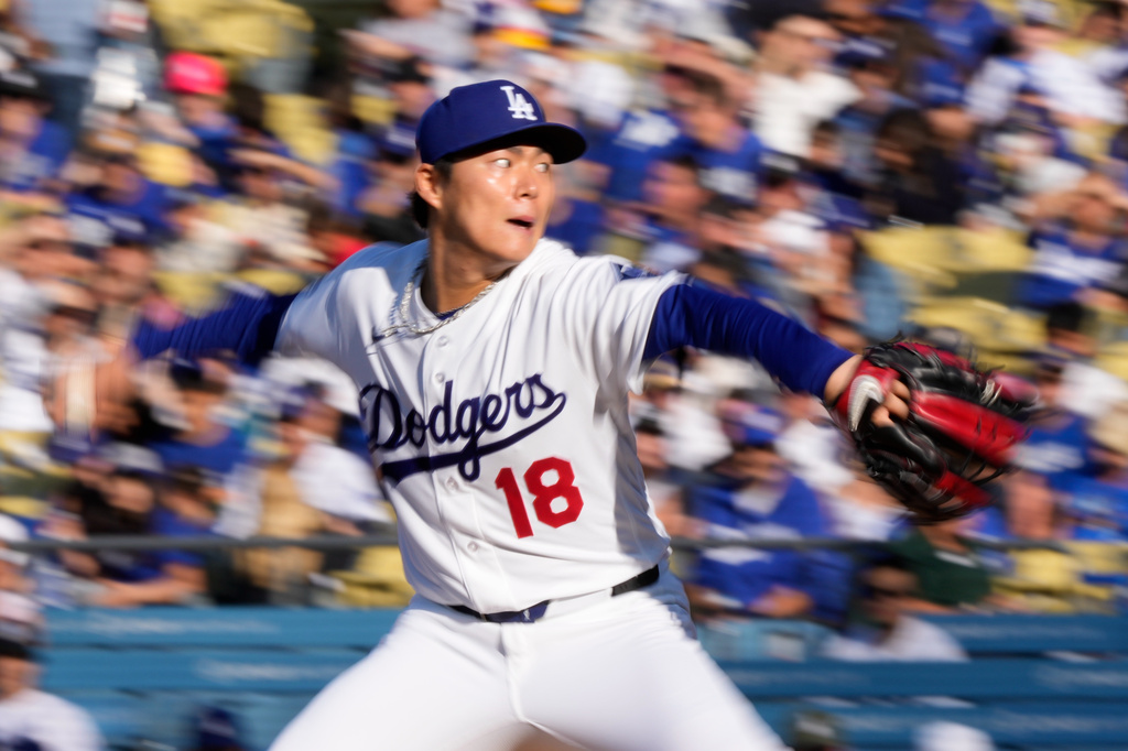 Los Angeles Dodgers starting pitcher Yoshinobu Yamamoto throws to the plate during the first inning of a baseball game against the Cleveland Guardians, Wednesday, April 1, 2026, in Los Angeles. (AP Photo/Mark J. Terrill)