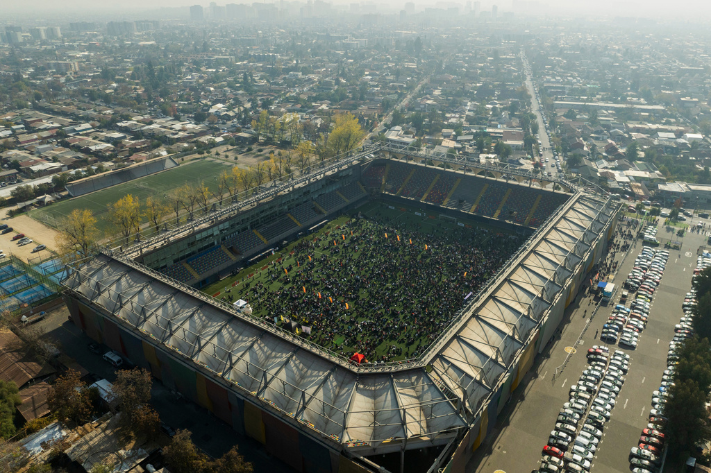 Soccer fans gather to trade Panini World Cup sticker albums and trading cards at the Bicentenario de La Florida stadium in Santiago, Chile, Sunday, May 31, 2026. (AP Photo/Esteban Felix)