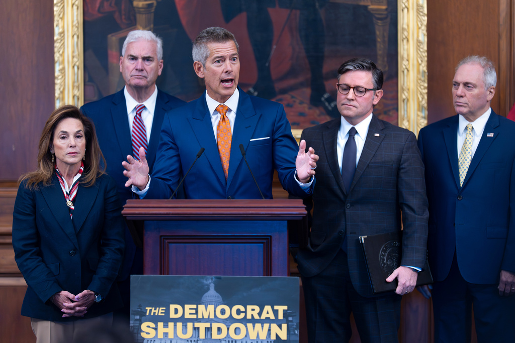 Transportation Secretary Sean Duffy, center, is joined at a news conference by, from left, Rep. Lisa McClain, R-Mich., House Majority Whip Tom Emmer, R-Minn., Speaker of the House Mike Johnson, R-La., and House Majority Leader Steve Scalise, R-La., on day 23 of the government shutdown, at the Capitol in Washington, Thursday, Oct. 23, 2025. (AP Photo/J. Scott Applewhite)