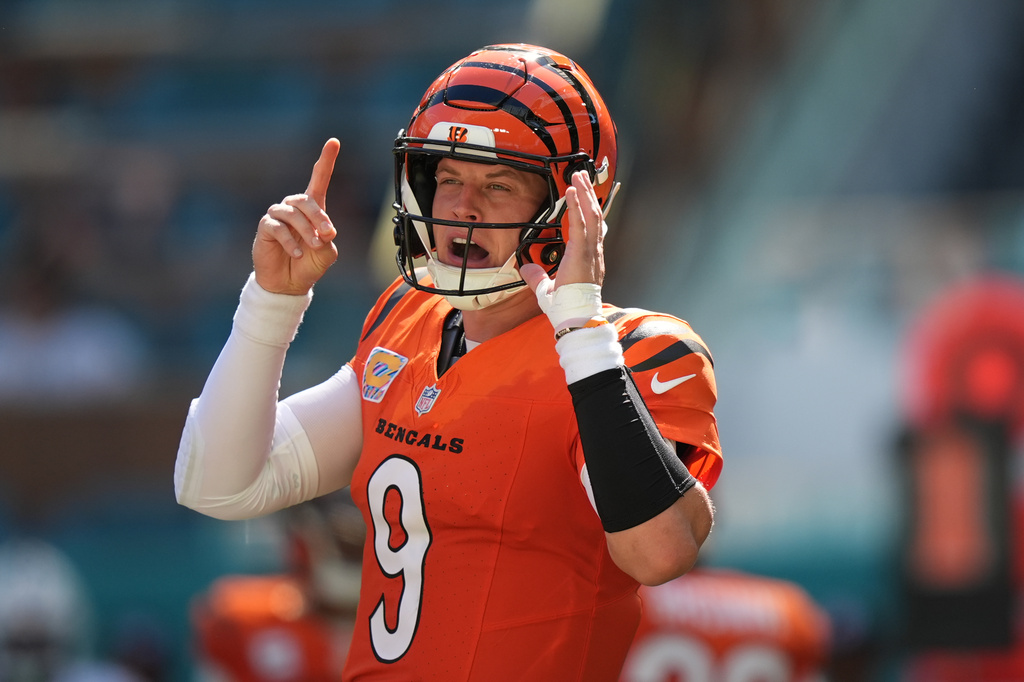 Cincinnati Bengals quarterback Joe Burrow (9) calls a play during the second half of an NFL football game against the Miami Dolphins in Miami Gardens, Fla., Sunday, Oct. 11, 2026. (AP Photo/Rebecca Blackwell)