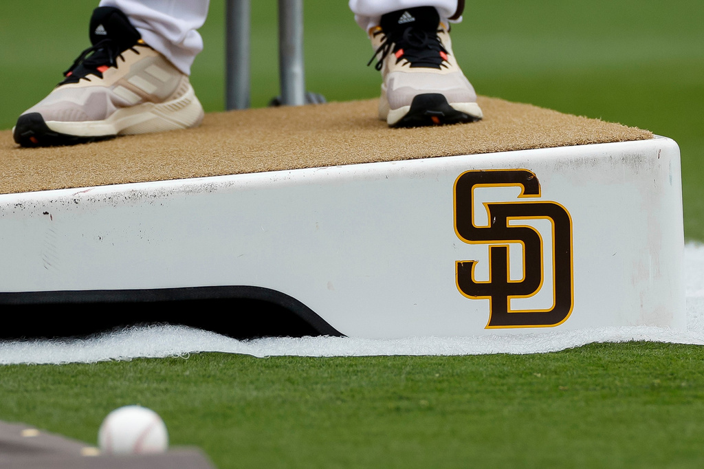 FILE - Detailed view of a San Diego Padres logo on a pitching mound during batting practice prior to a baseball game between the Padres and Boston Red Sox, May 20, 2023, in San Diego. (AP Photo/Brandon Sloter, File)