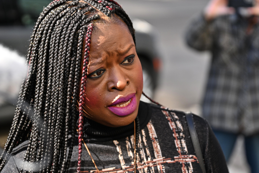 Nekima Levy Armstrong, center, speaks outside the U.S. District Courthouse in St. Paul, Minn., Friday, Feb. 13, 2026. (AP Photo/Tom Baker)