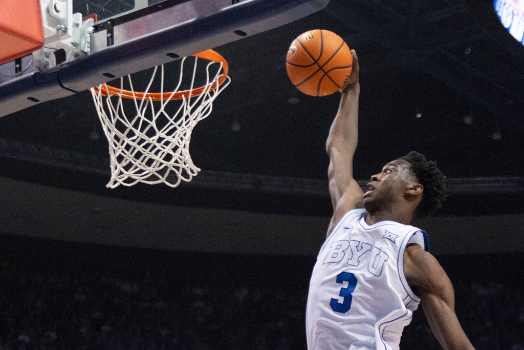 BYU forward AJ Dybantsa (3) prepares to dunk the ball against Eastern Washington during the first half of an NCAA basketball game, Monday, Dec. 22, 2025, in Provo, Utah. (AP Photo/Rob Gray)