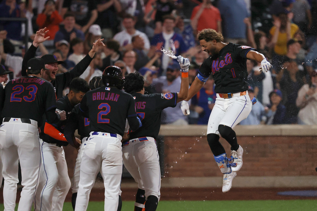 New York Mets' MJ Melendez reacts with teammates after hitting a walk off two run home run leading Vidal Bruján to score during the 10th inning of a baseball game against the Miami Marlins Friday, May 29, 2026, in New York. (AP Photo/Pamela Smith)