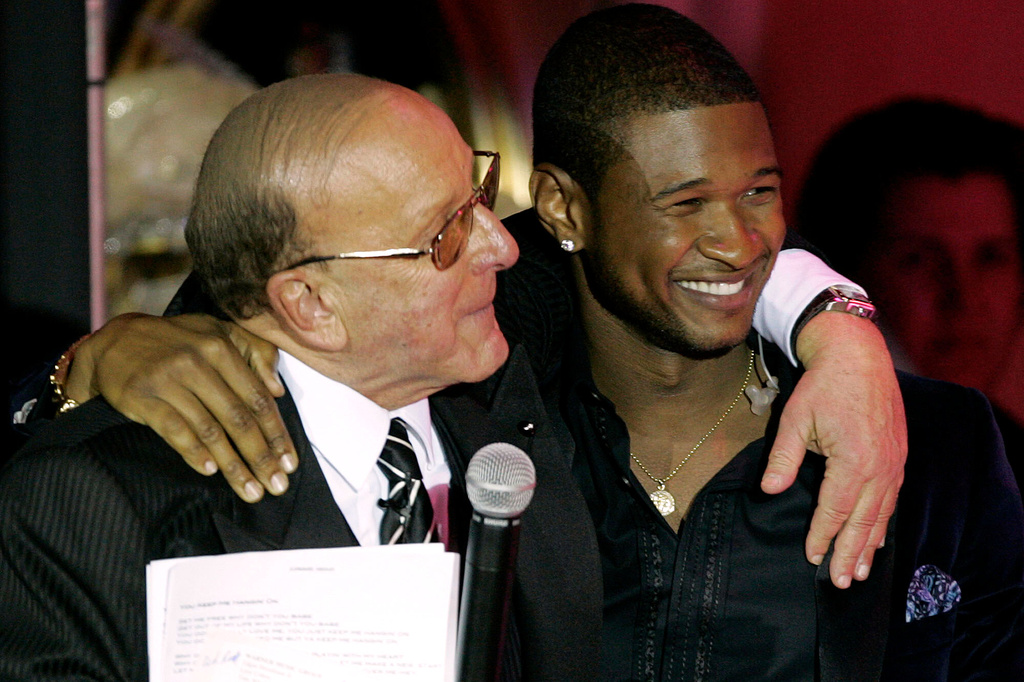 FILE - Clive Davis, left, and Usher appear at Davis' 2005 pre Grammy party in Beverly Hills, Calif. on Feb. 12, 2005. (AP Photo/Chris Polk, File)