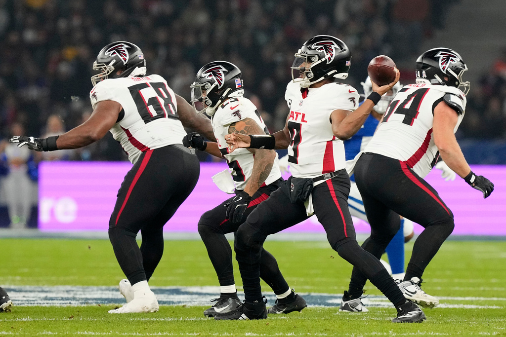Atlanta Falcons quarterback Michael Penix Jr. (9) throws a pass during the second half of an NFL football game against the Indianapolis Colts, Sunday, Nov. 9, 2025, in Berlin, Germany. (AP Photo/Martin Meissner)