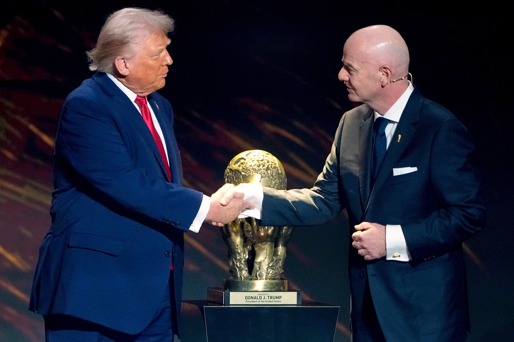 FILE - FIFA President Gianni Infantino, right, awards President Donald Trump with the FIFA Peace Prize during the draw for the 2026 soccer World Cup at the Kennedy Center in Washington, Dec. 5, 2025. (AP Photo/Chris Carlson, File)