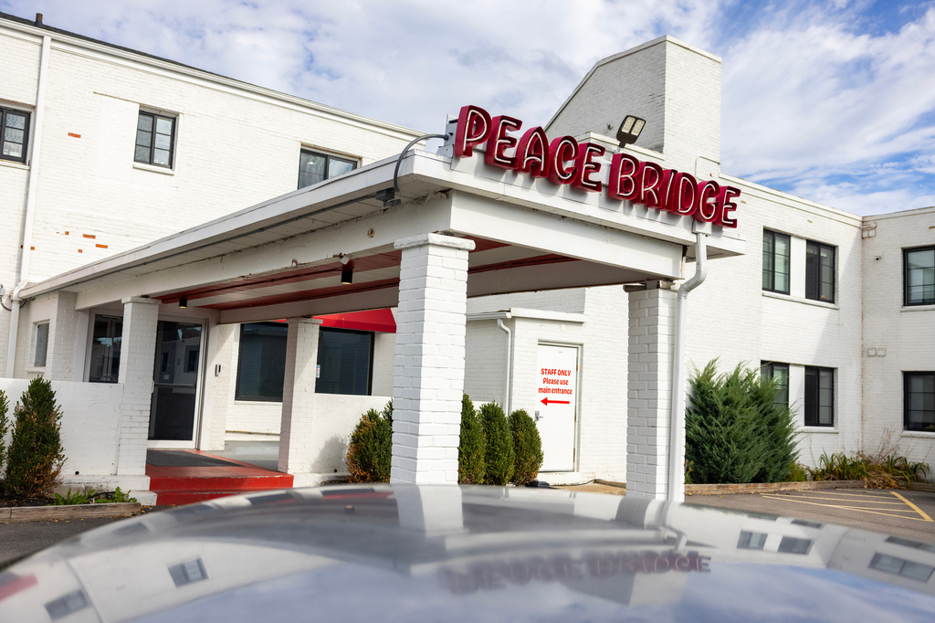 A sign is displayed for Peace Bridge Place apartments that have Viridi's lithium-ion battery energy storage system in Buffalo, N.Y., Thursday, Oct. 15, 2026. (AP Photo/Lauren Petracca)