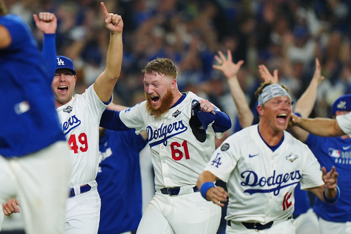 Winning Los Angeles Dodgers pitcher Will Klein (61) celebrates with Blake Treinen (49) and Alex Call (12) during 18th inning Game 3 World Series playoff MLB baseball action in Los Angeles on Monday, Oct. 27, 2025. (Frank Gunn/The Canadian Press via AP) Winning Los Angeles Dodgers pitcher Will Klein (61) celebrates with Blake Treinen (49) and Alex Call (12) during 18th inning Game 3 World Series playoff MLB baseball action in Los Angeles on Monday, Oct. 27, 2025. (Frank Gunn/The Canadian Press via AP)