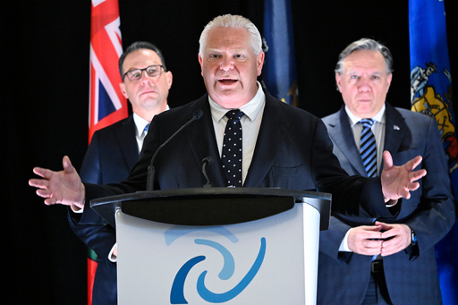Pennsylvania Governor Josh Shapiro, left, and Quebec Premier Francois Legault, right, look on as Ontario Premier Doug Ford speaks at a news conference at the end of the Great Lakes and St.Lawrence Governors & Premiers meeting in Quebec City, Quebec, Monday, Oct. 6, 2025. (Jacques Boissinot/The Canadian Press via AP) Pennsylvania Governor Josh Shapiro, left, and Quebec Premier Francois Legault, right, look on as Ontario Premier Doug Ford speaks at a news conference at the end of the Great Lakes and St.Lawrence Governors & Premiers meeting in Quebec City, Quebec, Monday, Oct. 6, 2025. (Jacques Boissinot/The Canadian Press via AP)