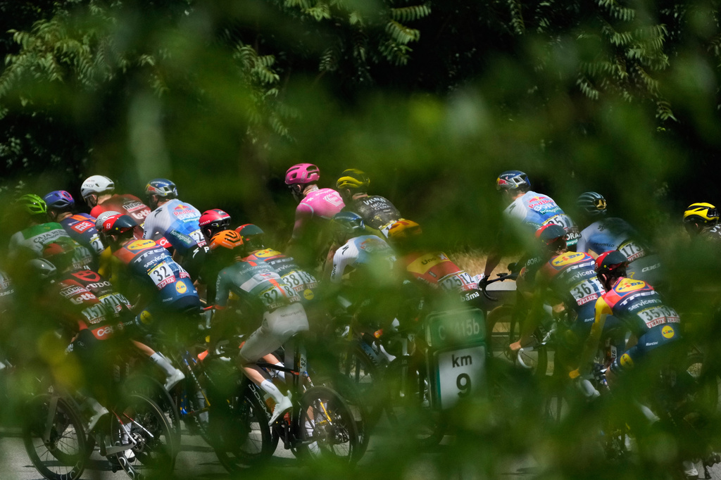 The pack rides during the third stage of the Tour de France cycling race with start in Granollers and finish in Les Angles, France, Monday, July 6, 2026. (AP Photo/Mosa'ab Elshamy)