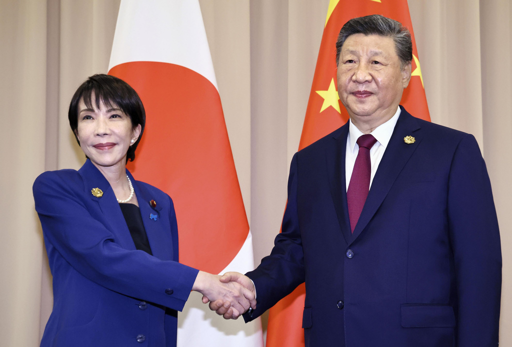 FILE - Chinese President Xi Jinping, right, shakes hands with Japanese Prime Minister Sanae Takaichi ahead of their meeting in Gyeongju, South Korea, Oct. 31, 2025. (Kyodo News via AP, File)