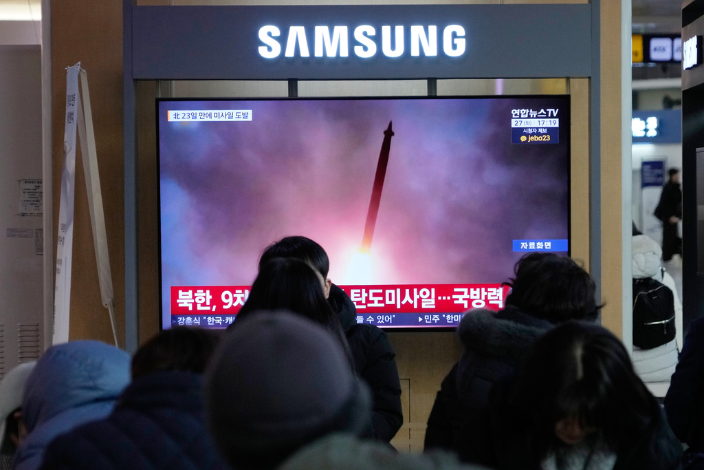 A TV screen shows a file image of North Korea's missile launch during a news program at Seoul Railway Station in Seoul, South Korea, Tuesday, Jan. 27, 2026. (AP Photo/Ahn Young-joon)