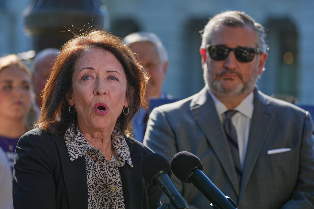 Sen. Maria Cantwell, D-Wash., left, speaks as Sen. Ted Cruz, R-Texas, right, listens during a news conference on Capitol Hill, Monday, Sept. 14, 2026, in Washington. (AP Photo/Mariam Zuhaib)