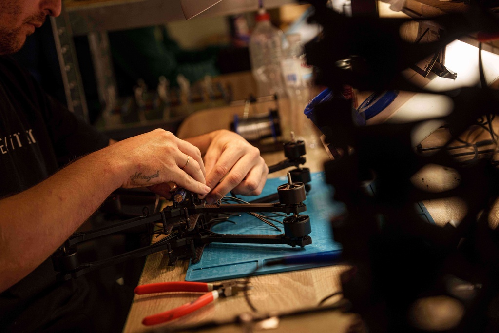 An engineer assembles FPV drone of "General Cherry" company at the workshop in Ukraine, on Dec. 4, 2025. (AP Photo/Evgeniy Maloletka)
