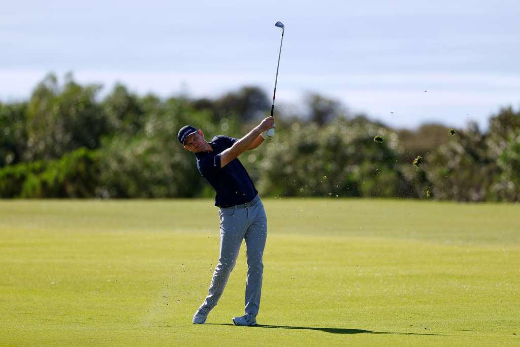 Justin Rose, of England, hits from the 17th fairway while playing the South Course at Torrey Pines during the second round of the Farmers Insurance Open golf tournament Friday, Jan. 30, 2026, in San Diego. (AP Photo/Caroline Brehman)