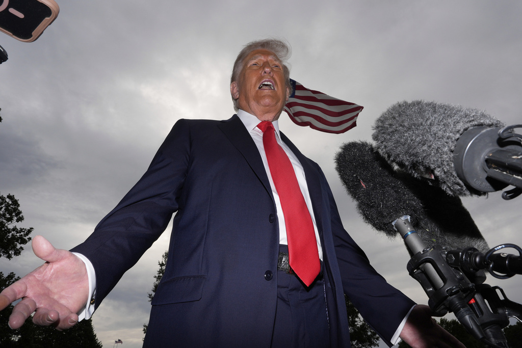 President Donald Trump speaks with reporters before departing on Marine One from the South Lawn of the White House, Tuesday, Sept. 16, 2025, in Washington. (AP Photo/Alex Brandon)