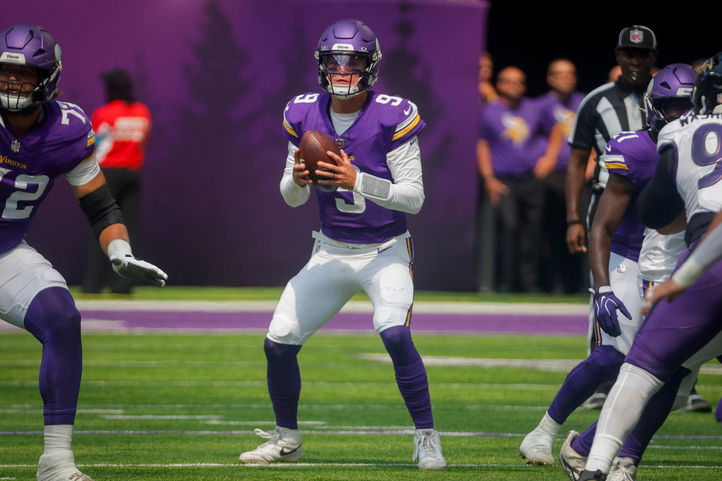 FILE - Minnesota Vikings quarterback J.J. McCarthy looks to pass against the Baltimore Ravens during the first half of an NFL preseason football game, Saturday, Aug. 22, 2026, in Minneapolis. (AP Photo/Bruce Kluckhohn, File)