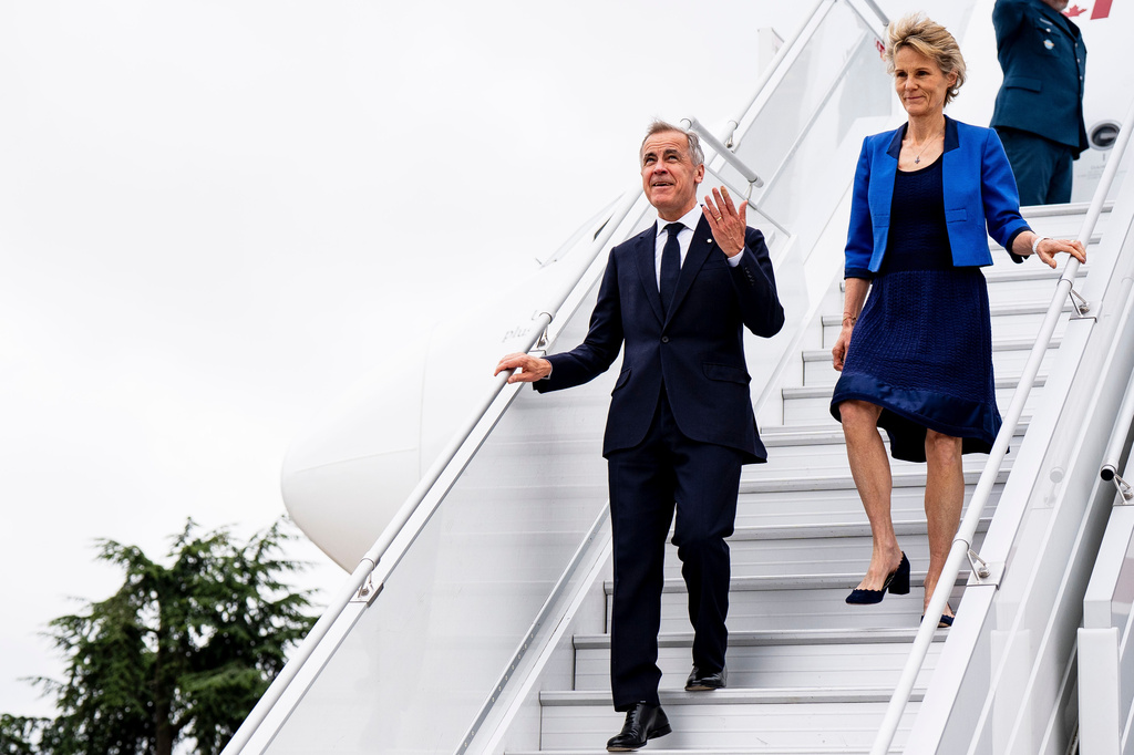 Prime Minister Mark Carney and Diana Fox Carney arrive in Paris, on Friday, June 12, 2026. (Christopher Katsarov/The Canadian Press via AP)