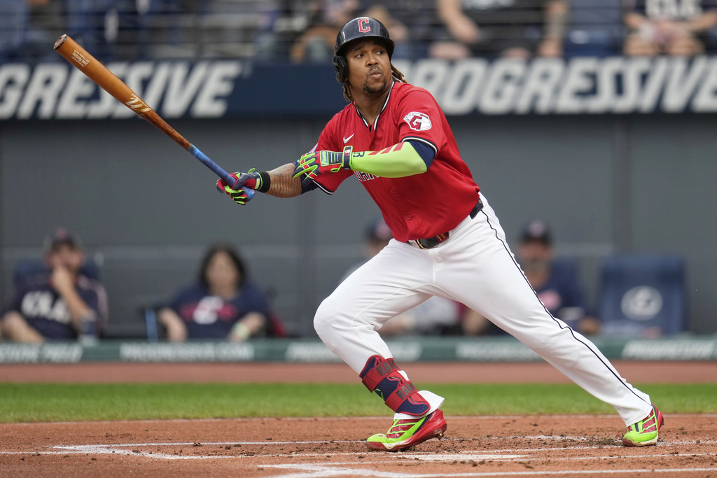 Cleveland Guardians' Jose Ramirez runs to first base after striking out on a wild pitch in the first inning of a baseball game against the Chicago White Sox in Cleveland, Saturday, Sept. 13, 2025. (AP Photo/Sue Ogrocki)