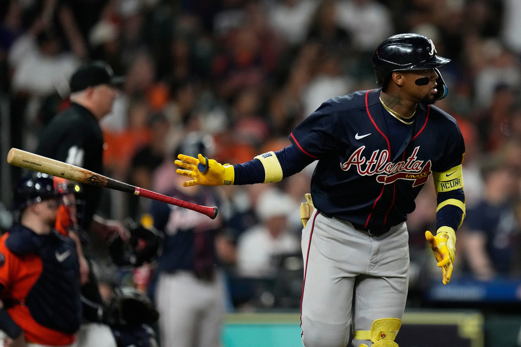 Atlanta Braves' Ronald Acu&ntilde;a Jr. tosses his bat after hitting a home run during the seventh inning of a baseball game against the Houston Astros in Houston, Friday, Sept. 18, 2026. (AP Photo/Ashley Landis)