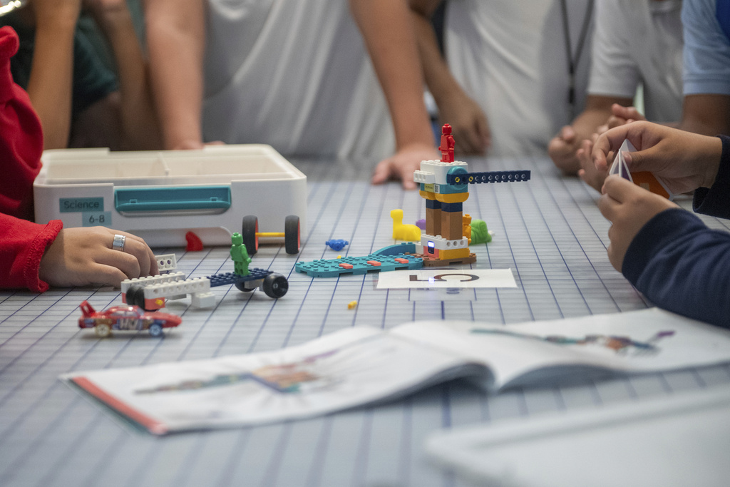 Students work on a project during a LEGO Education science lesson at Lorenzo De Zavala Middle School on Thursday, Aug. 21, 2025, in Irving, Texas. (AP Photo/Ronaldo Bolaños)