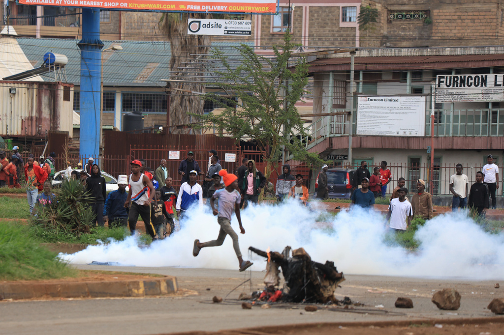 People protest during a public transport strike over fuel prices in Nairobi, Kenya, Monday, May 18, 2026. (AP Photo/Andrew Kasuku)